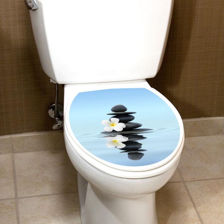 Stickers muraux pour WC - Sticker abattant wc Zen galets noirs sur l’eau - ambiance-sticker.com